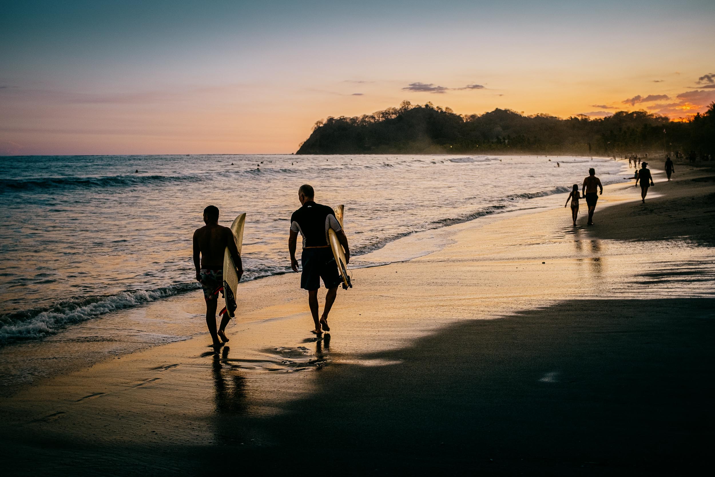 sunset surfers walking playa samara costa rica