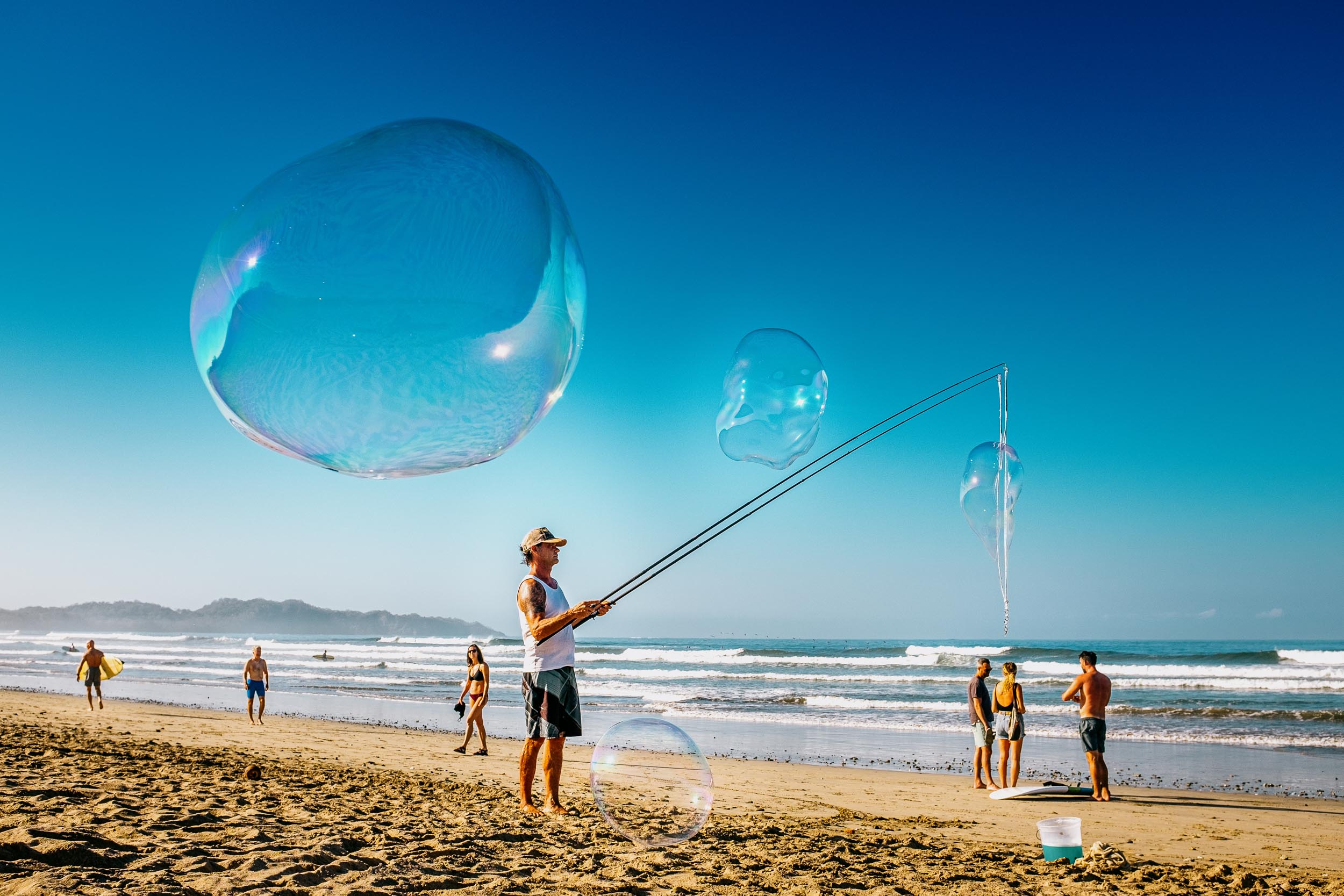 blowing bubbles on the beach playa guiones costa rica