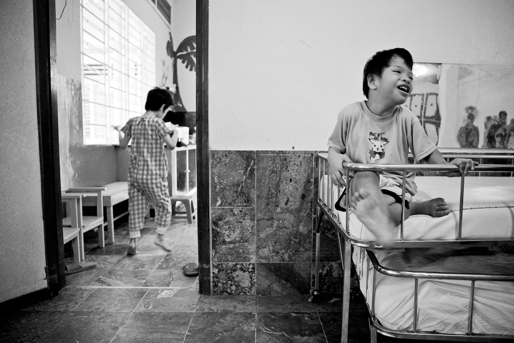 boys play and laugh in orphanage - ho chi minh city vietnam
