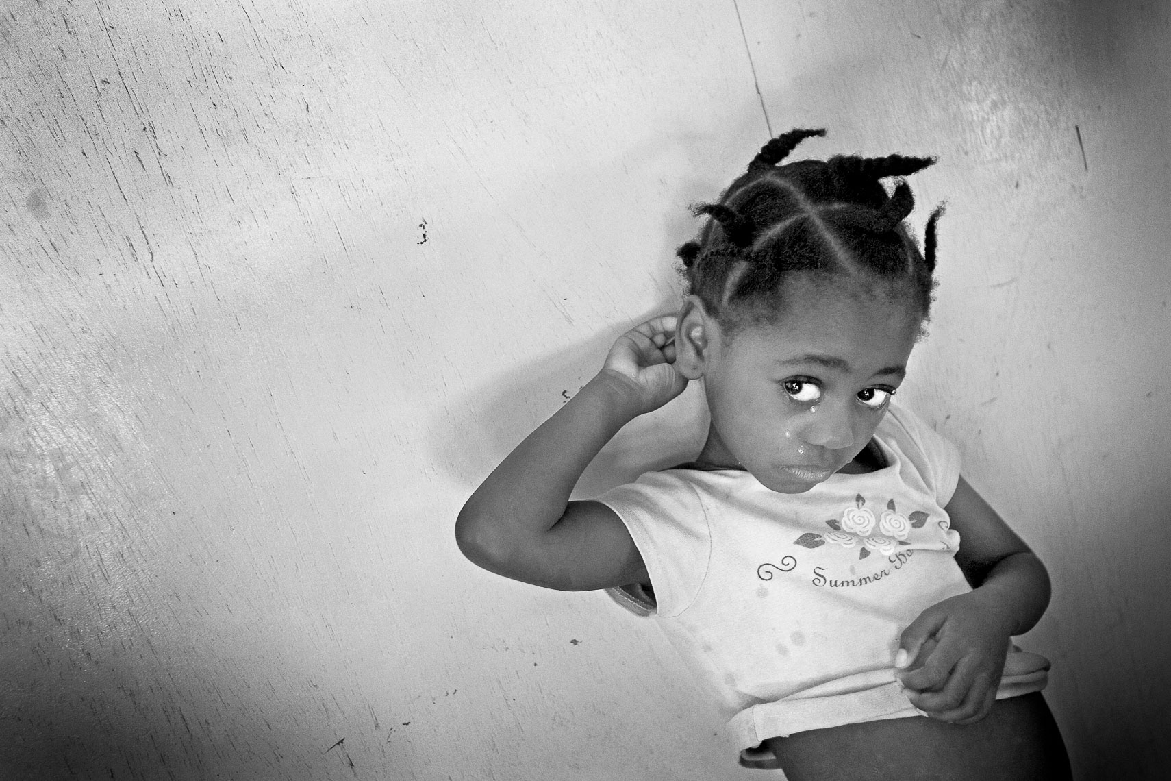 young girl receives tuberculosis medicine at house of hope orphanage la pointe port de paix haiti
