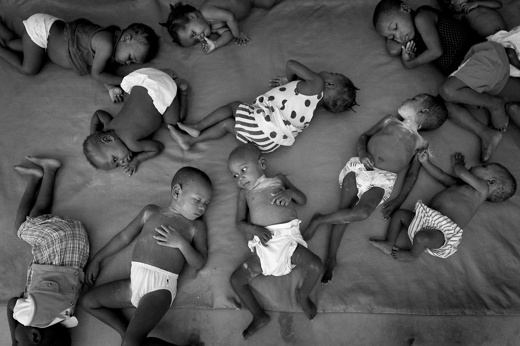 pile of babies in house of hope orphanage in la pointe port de paix haiti