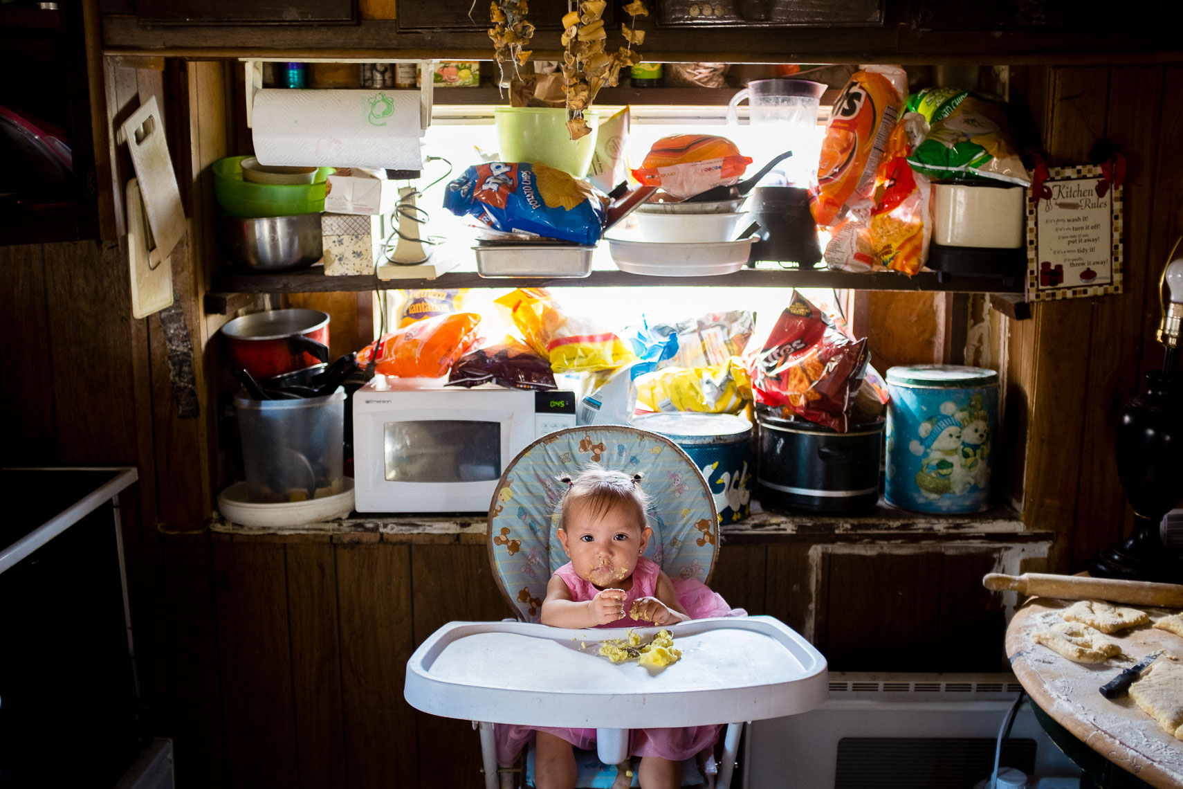 young baby girl eats her easter meal on the oglala sioux pine ridge indian reservation nation