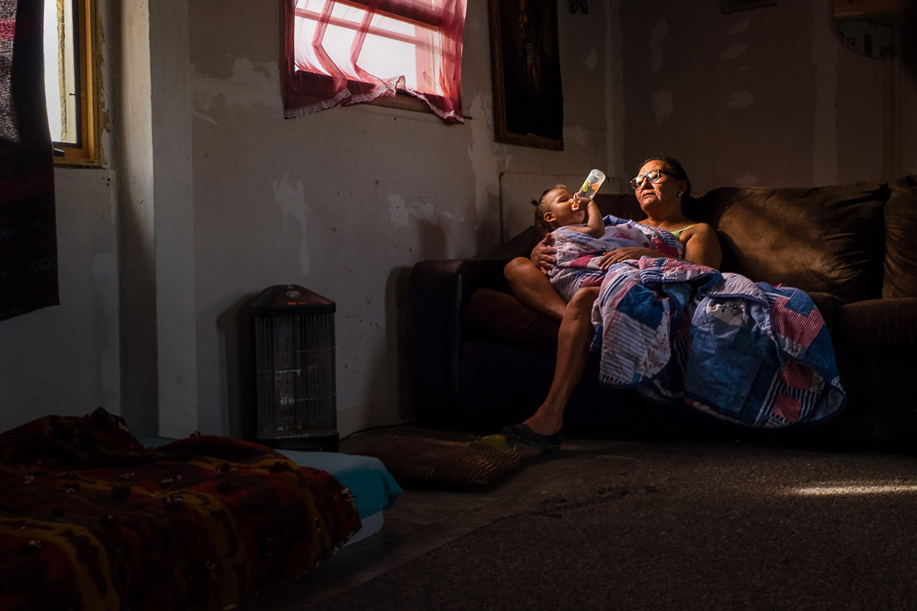 grandmother and granddaughter resting in the sun beam pine ridge indian reservation Oglala Sioux nation
