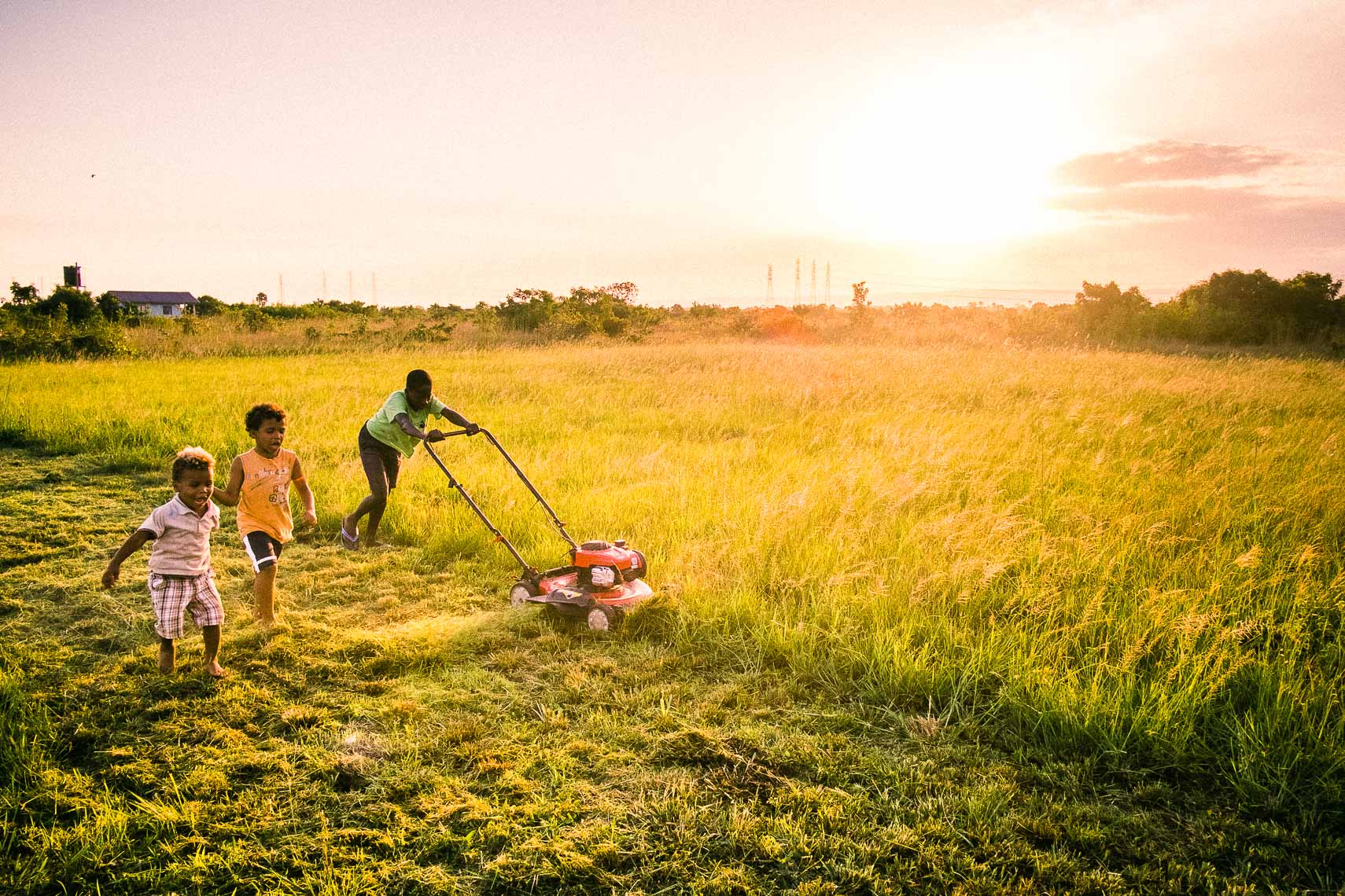mowing the grass - city of refuge - tema ghana